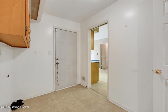 interior space featuring visible vents and baseboards