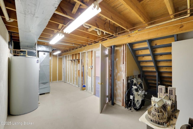 unfinished below grade area featuring water heater and heating unit