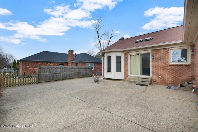 view of patio featuring entry steps and fence private yard