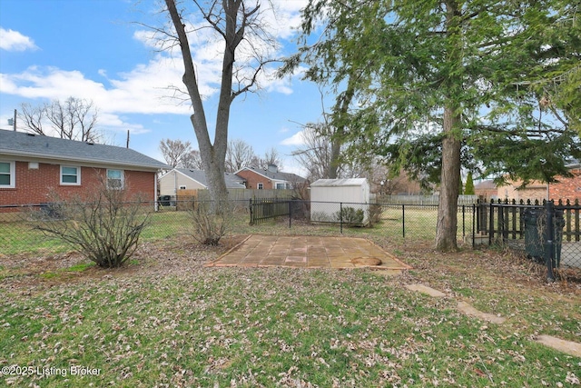 view of yard with an outdoor structure and a fenced backyard