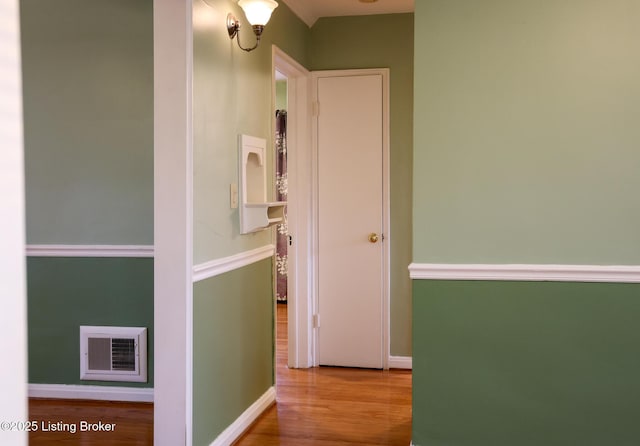 hall with wood-type flooring