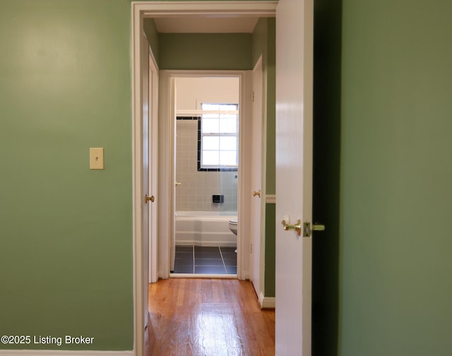 hallway with light wood-type flooring