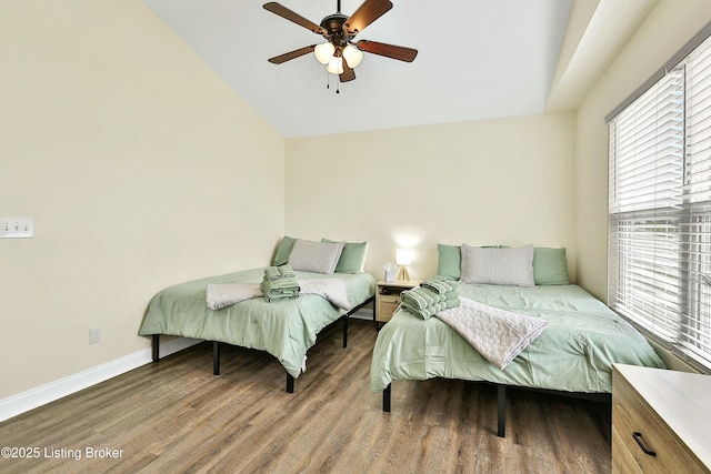 bedroom featuring ceiling fan and dark hardwood / wood-style floors