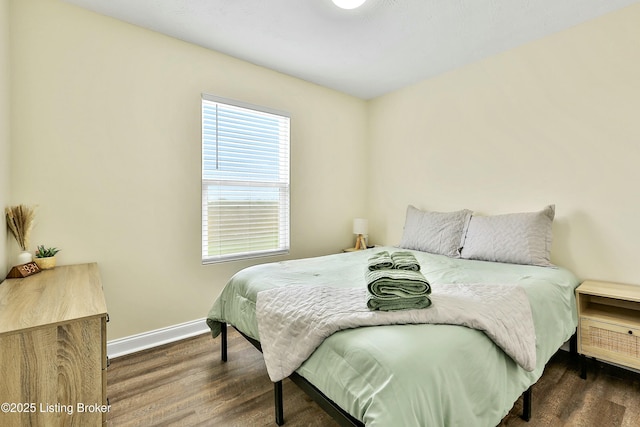 bedroom featuring dark hardwood / wood-style floors