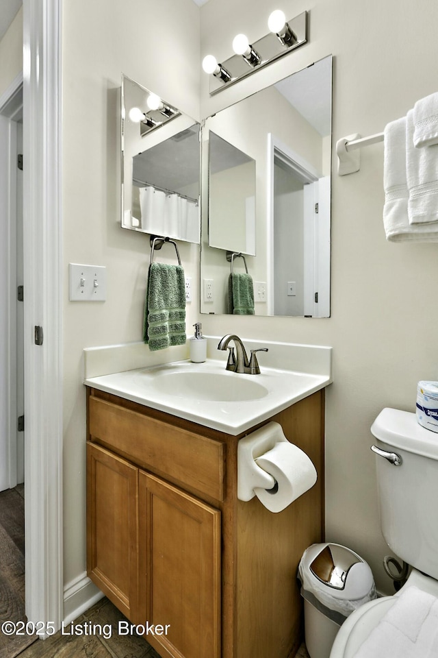 bathroom with vanity and toilet