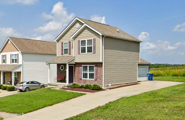 view of front of home featuring a front yard and a garage