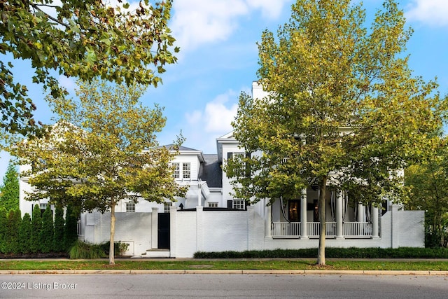 view of property hidden behind natural elements