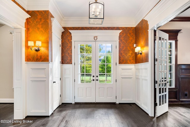 entryway with french doors, dark hardwood / wood-style flooring, and ornamental molding