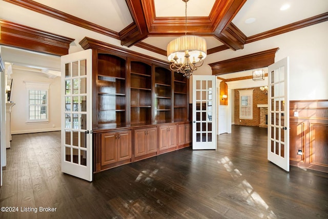 interior space with a chandelier, french doors, dark hardwood / wood-style floors, and crown molding