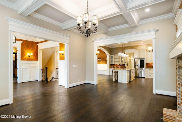 unfurnished living room with crown molding, sink, beamed ceiling, and coffered ceiling