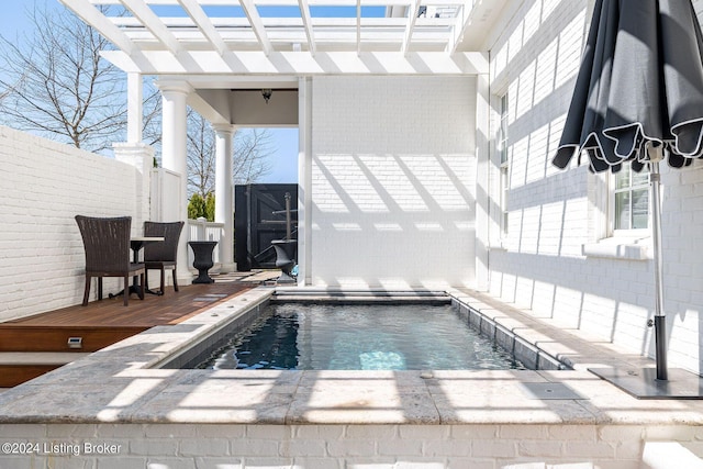 view of pool featuring a pergola and a deck