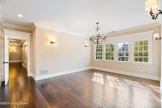 unfurnished room featuring a chandelier, dark hardwood / wood-style floors, and ornamental molding