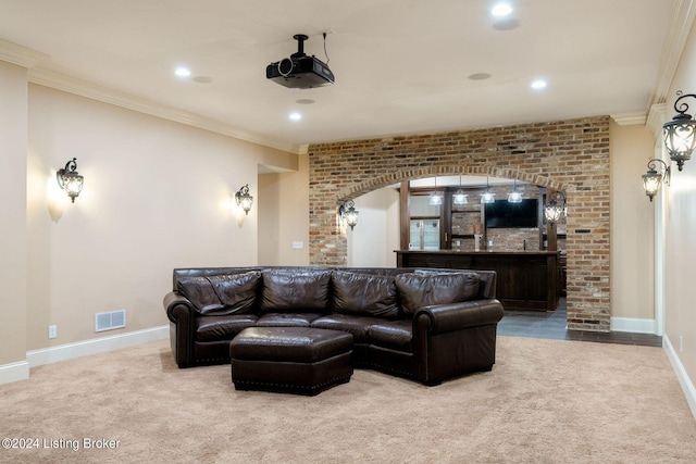 interior space featuring light colored carpet, ornamental molding, and brick wall