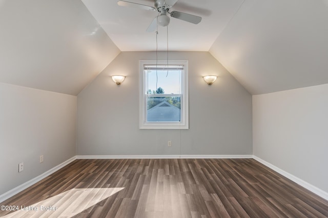 additional living space with ceiling fan, dark wood-type flooring, and lofted ceiling