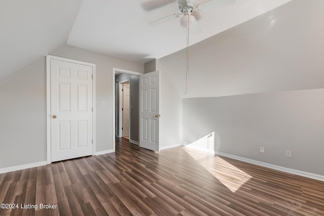 additional living space with dark hardwood / wood-style flooring, ceiling fan, and lofted ceiling