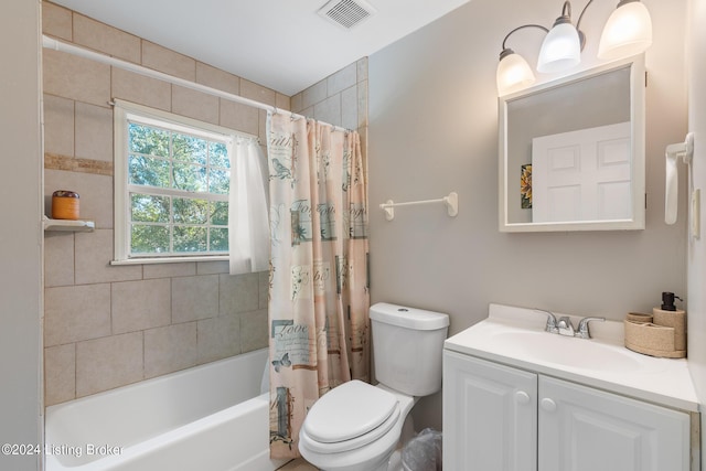 full bathroom featuring vanity, toilet, and shower / tub combo