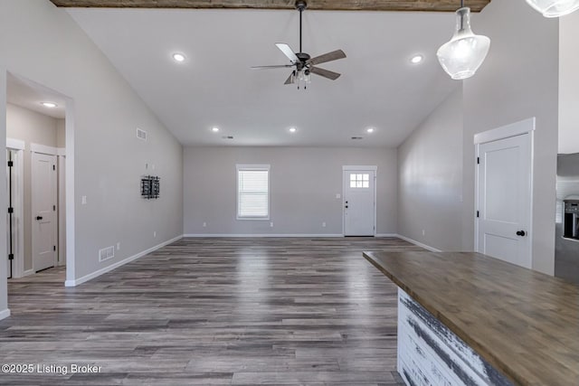 unfurnished living room with high vaulted ceiling, ceiling fan, and dark hardwood / wood-style flooring