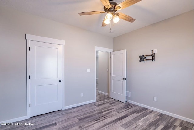 unfurnished bedroom featuring ceiling fan and light hardwood / wood-style floors