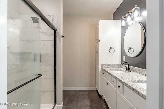 bathroom featuring vanity and a shower with shower door