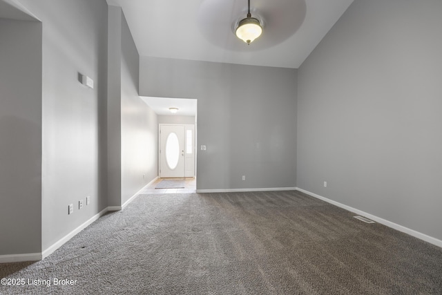 unfurnished room featuring ceiling fan and carpet