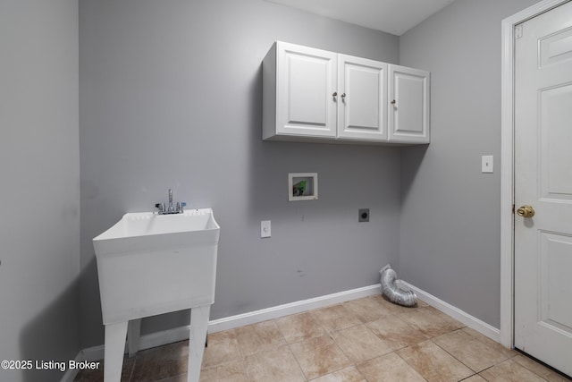 laundry area featuring light tile patterned flooring, sink, cabinets, hookup for a washing machine, and hookup for an electric dryer