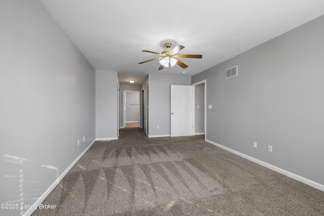 unfurnished bedroom featuring dark carpet and ceiling fan