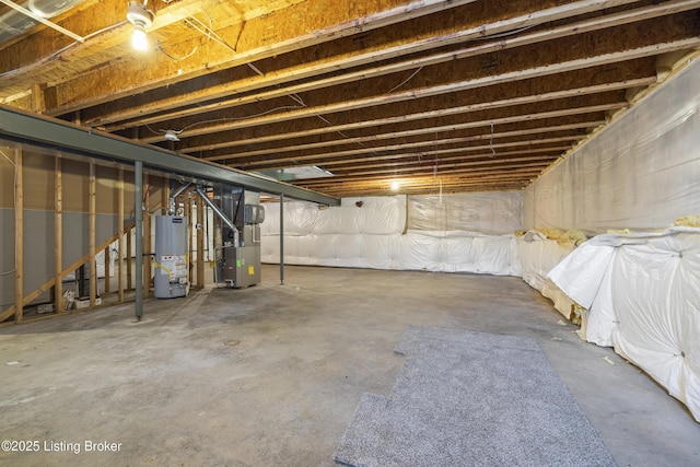 basement featuring heating unit and water heater