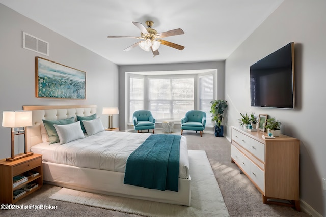 carpeted bedroom with ceiling fan