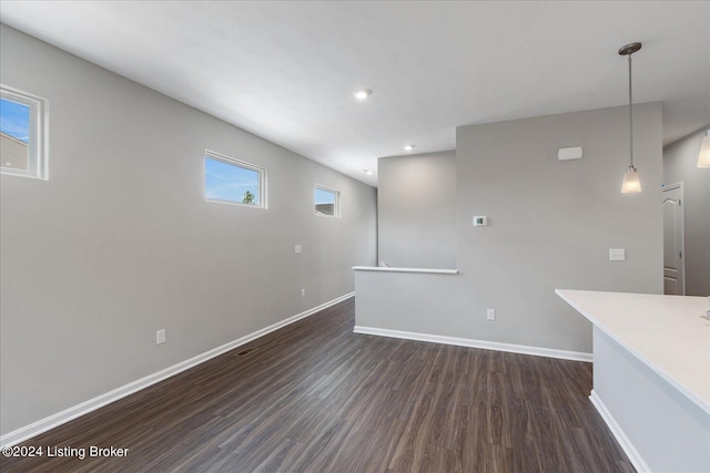 unfurnished living room with dark hardwood / wood-style flooring