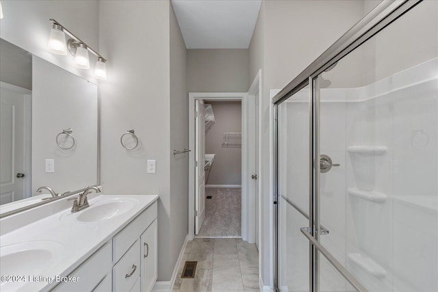 bathroom with vanity and walk in shower