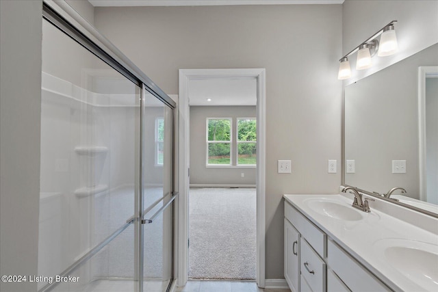 bathroom with vanity and walk in shower