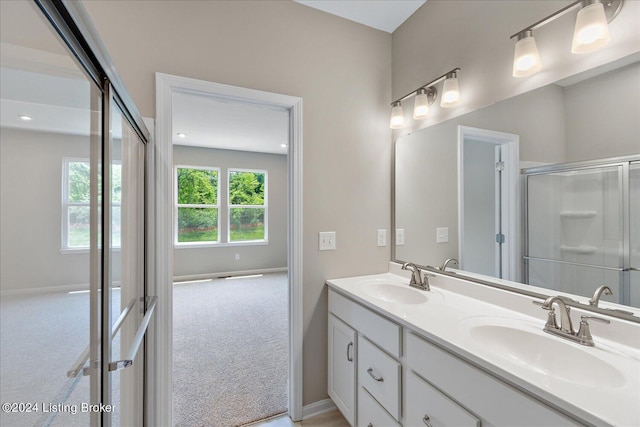 bathroom with vanity and walk in shower