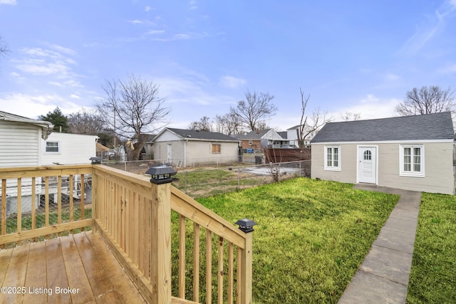 exterior space featuring a deck and a front lawn