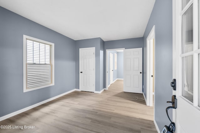 entryway with light hardwood / wood-style flooring