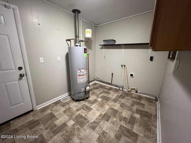 utility room featuring gas water heater