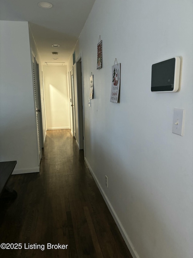 hallway featuring dark hardwood / wood-style flooring