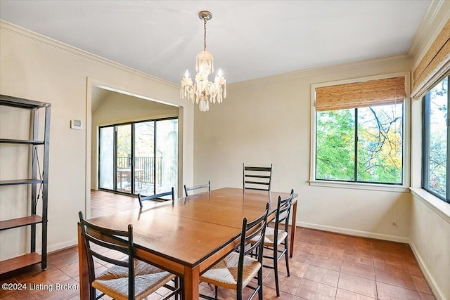 dining space featuring tile patterned flooring, a chandelier, and ornamental molding