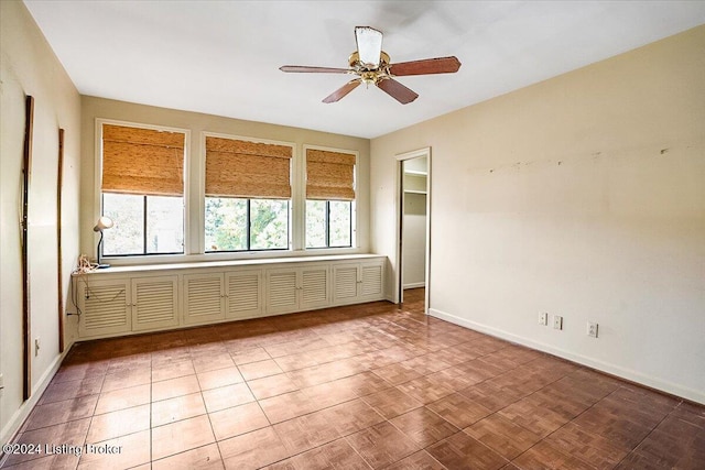 spare room with ceiling fan and parquet floors