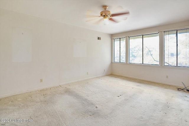 carpeted empty room with ceiling fan