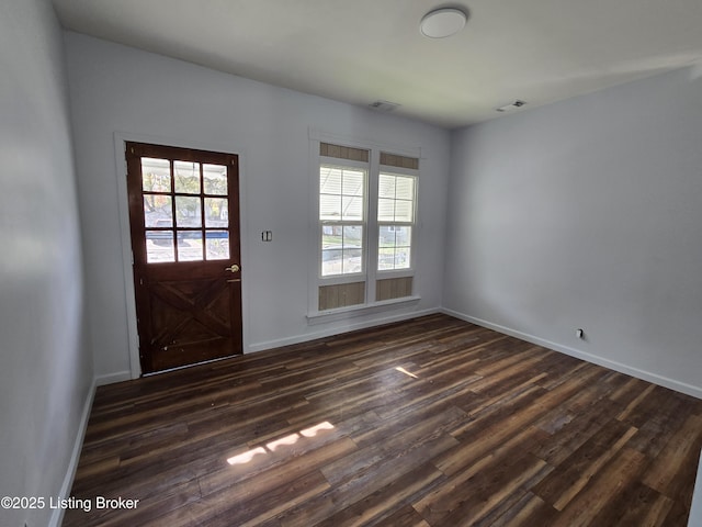 entryway with dark hardwood / wood-style floors