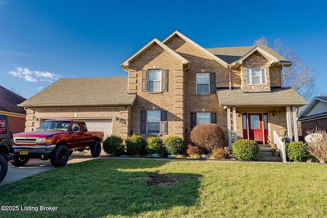 view of front of house featuring a front yard and a garage