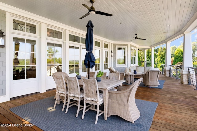 wooden terrace featuring ceiling fan