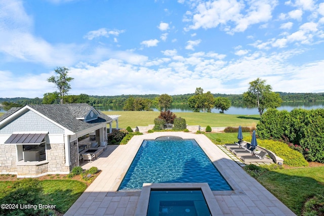 view of swimming pool with a lawn, a water view, an in ground hot tub, and a patio