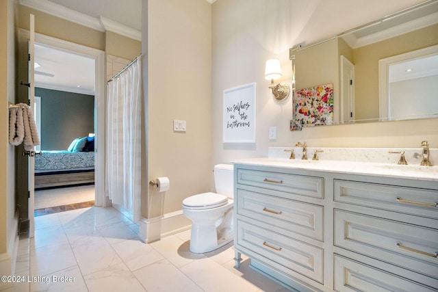 bathroom featuring vanity, toilet, and ornamental molding