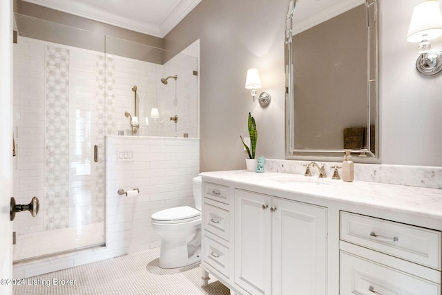 bathroom with tile patterned floors, toilet, a shower with door, vanity, and ornamental molding