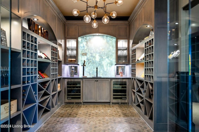 wine cellar featuring wine cooler and indoor wet bar