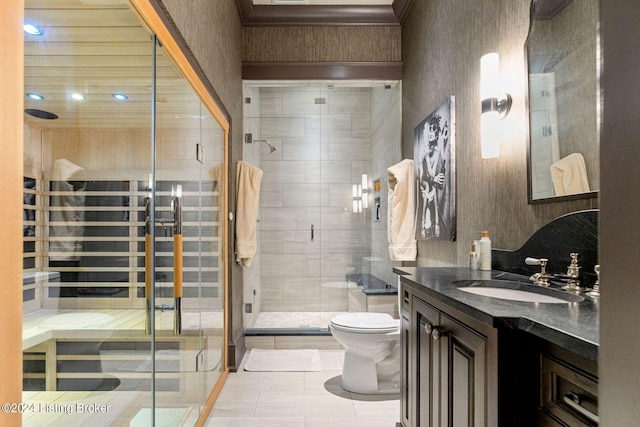 bathroom featuring tile patterned floors, vanity, an enclosed shower, and toilet