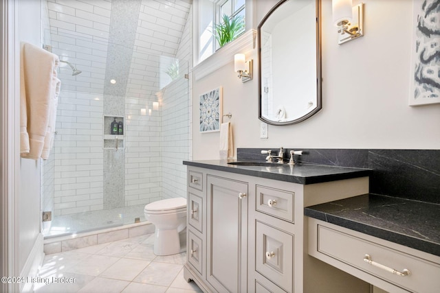 bathroom with vanity, toilet, and a shower with shower door