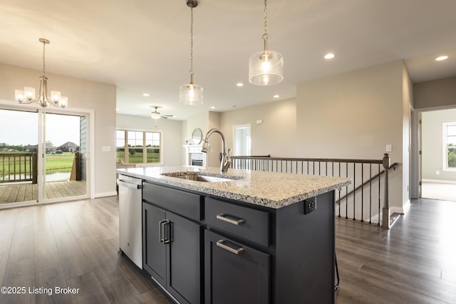 kitchen with dishwasher, sink, ceiling fan, an island with sink, and decorative light fixtures