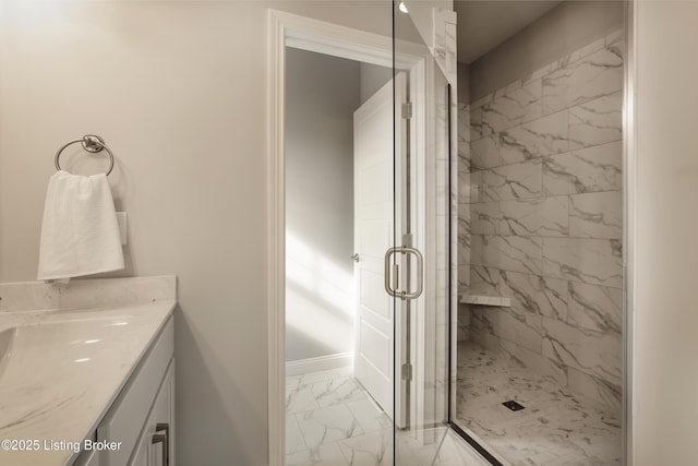 bathroom featuring vanity and a shower with shower door